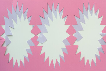 machine-cut paper stencils with starburst effect cutouts on blank paper