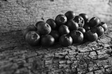 Blueberries on a wooden background.