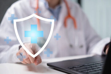 Professional healthcare medical worker holding health with shield icon health insurance concept
