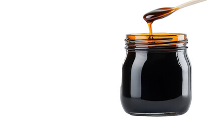 A jar of dark syrup with a wooden spoon, showcasing rich texture and flavor. transparent background