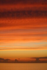 Fototapeta premium Red and orange sunset with clouds
