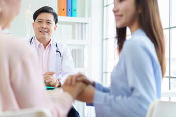 Asian woman take her elderly mother to see and health check in hospital.