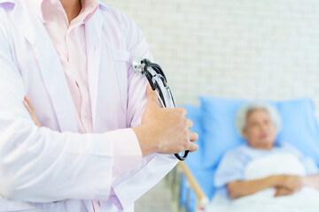 Naklejka premium Asian doctor portrait in recovery ward in hospital with copy space.