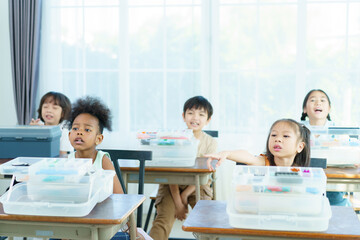 Group of diverse children enjoy learning about the STEM.