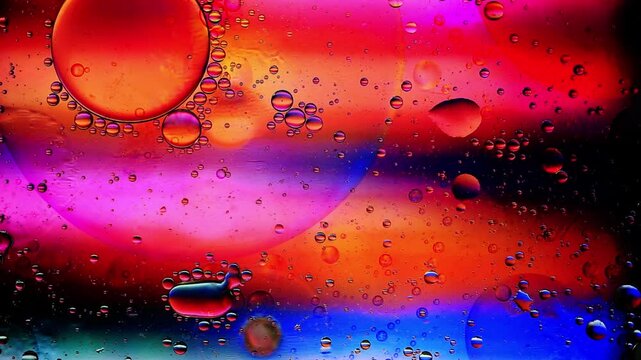 rad background of oil drop floating on water.