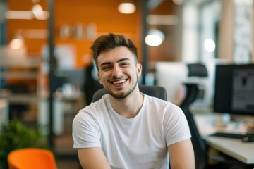 Obraz premium Smiling Young Businessman Modern Office - Startup Success, Teamwork, Growth Concept