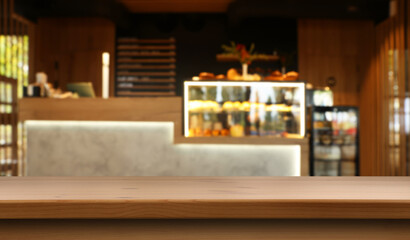 Empty wooden table in stylish cafe. Space for design