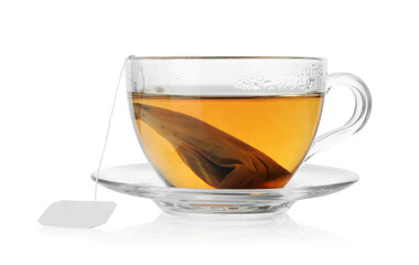Tea bag in glass cup with hot drink isolated on white