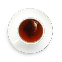 Tea bag in cup with hot drink isolated on white, top view