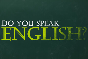 Obraz premium Do You Speak English? text on green chalkboard. Language course
