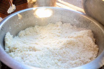 Rice is served in a large pot at a religious ceremony in Myanmar, which is Burmese rice food.