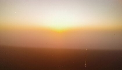 Vintage distressed abstract old photo of foggy sunrise, film grain, dust and scratches texture effect