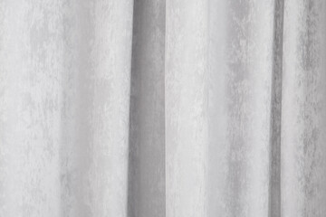 Fototapeta premium Soft gray curtains hanging elegantly in a serene indoor setting