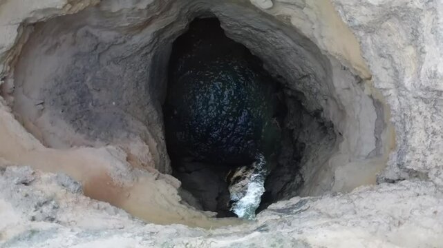 Aerial video above Gruta das Baratas Algarve Portugal