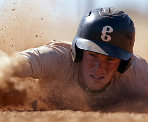 A player sliding into second base, creating a dramatic cloud of dirt and dust around the action.


