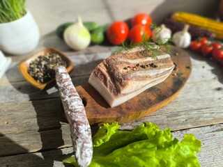 Delicious bacon from brisket on a wooden chopping board. High-quality photos