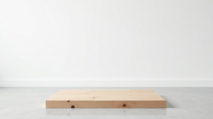 Simple Light Wooden Platform on Polished Floor Against White Wall