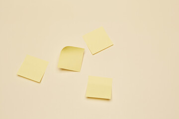 Four blank adhesive office sticky note sheet