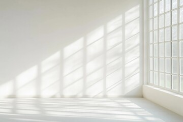 Empty bright room with large window. Sunlight casts patterns on white walls, floor. Modern minimalist style interior design. Simple clean space. Abstract light, shadow interplay. Great for