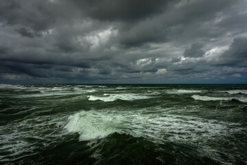 Dramatic Seascape: Rough Waves of the Atlantic Ocean against dark cloudy Sky; Copy Space