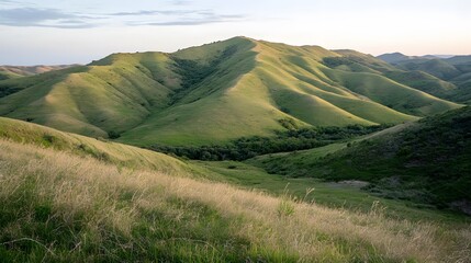Fototapeta premium Rolling Green Hills Landscape at Sunset Dramatic Mountain Scenery