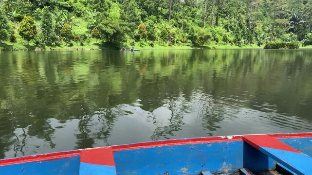 Hidden in the pine forests of Gununglurah, Telaga Kumpe is a serene mountain lake nestled on Mount Slamet's slopes. 