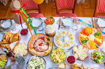 Easter breakfast with traditional holiday dishes and Easter cake.