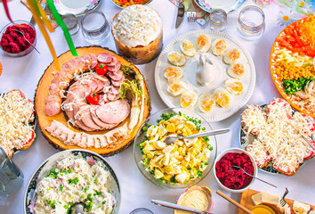 Easter breakfast with traditional holiday dishes and Easter cake.