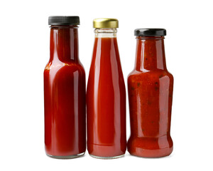 Different delicious sauces in glass bottles isolated on white
