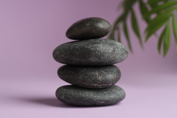 Stack of rocks on lilac background. Harmony and life balance