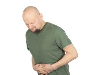 Bald man in green t-shirt suffering from severe stomach pain