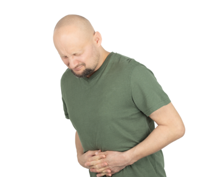 Bald man in green t-shirt suffering from severe stomach pain
