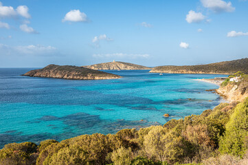 Aerial view of Tuerredda bay with the beach of fine sand and transparent blue and turquoise water