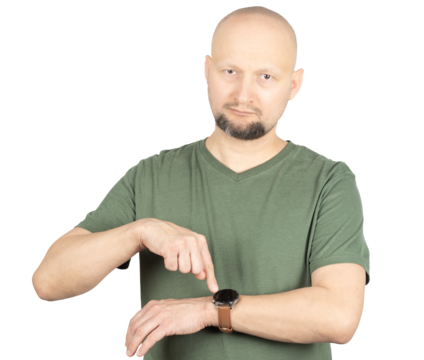 Man impatiently pointing at his wristwatch while looking serious