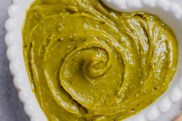 Delicious homemade pistachio paste or cream,spread with pistachios.