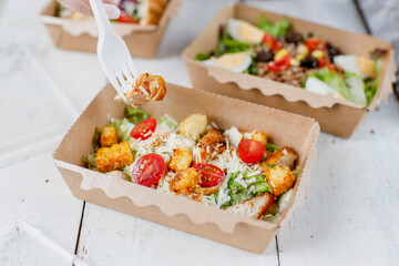 Healthy salads in plastic package for take away or food delivery.