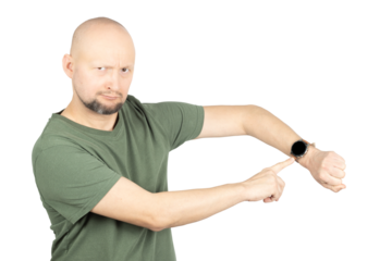 Serious man pointing at smartwatch with urgency