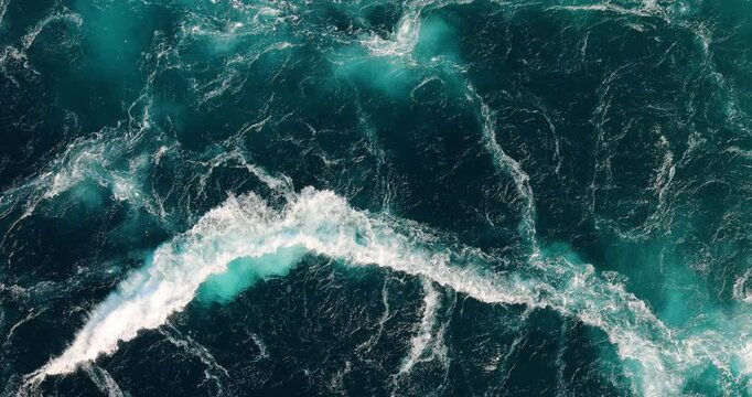 Blue waves of water of the river and the sea meet each other during high tide and low tide.