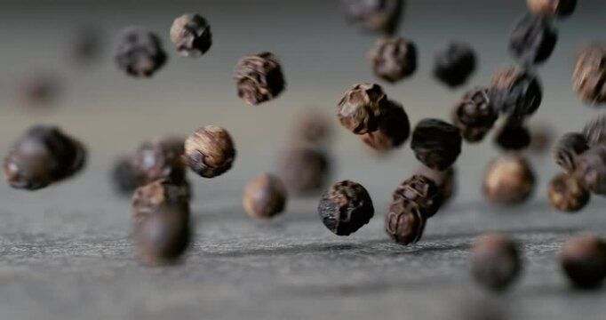 Peppercorns or black pepper spice. Super Macro Close Up. Shot on super slow motion camera 1000 fps.