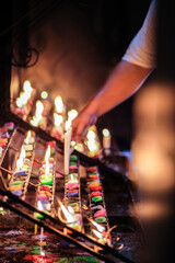 Burning candles inside Binondo church.