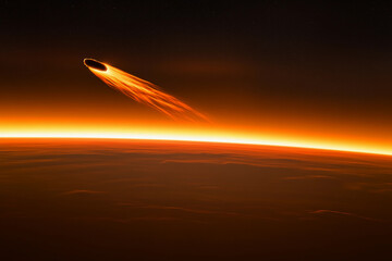 Comet streaks past a rocky surface under a starry sky in a breathtaking cosmic display at night