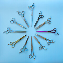 Set of pet grooming scissors arranged in a circle on a blue background