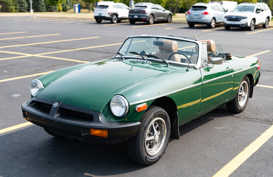 Chicago, Illinois, USA - September 08, 2024: MG MGB sportscar retro convertible vehicle, front view. Retro red sportscar. Convertible MG MGB car. MG MGB at Chicago