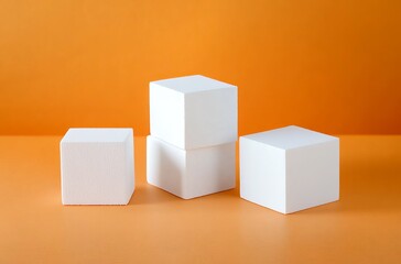 Fototapeta premium 3 white cubes of different sizes on an orange background, minimalistic, simple shapes, modern, product photography, studio lighting