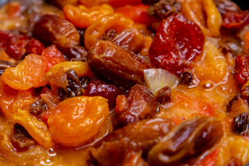 Red beans in tomato sauce with dried fruits stewed. Horizontal photo.