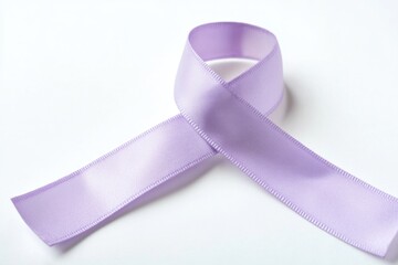 A close-up of a purple ribbon on a white surface