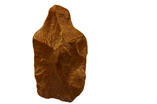Paleolithic hand axe made of stone on a white background.