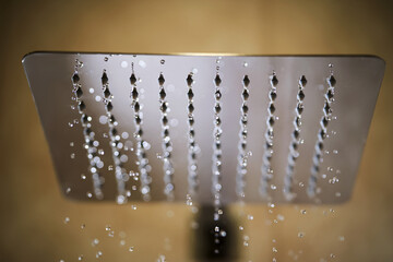 Abstract texture of water jets from the shower in close-up.