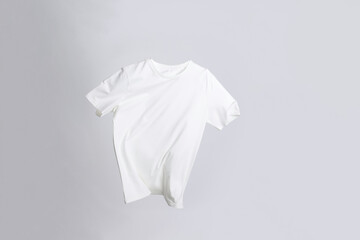 One stylish t-shirt in air on white background