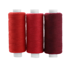 Spools of colorful sewing threads isolated on white